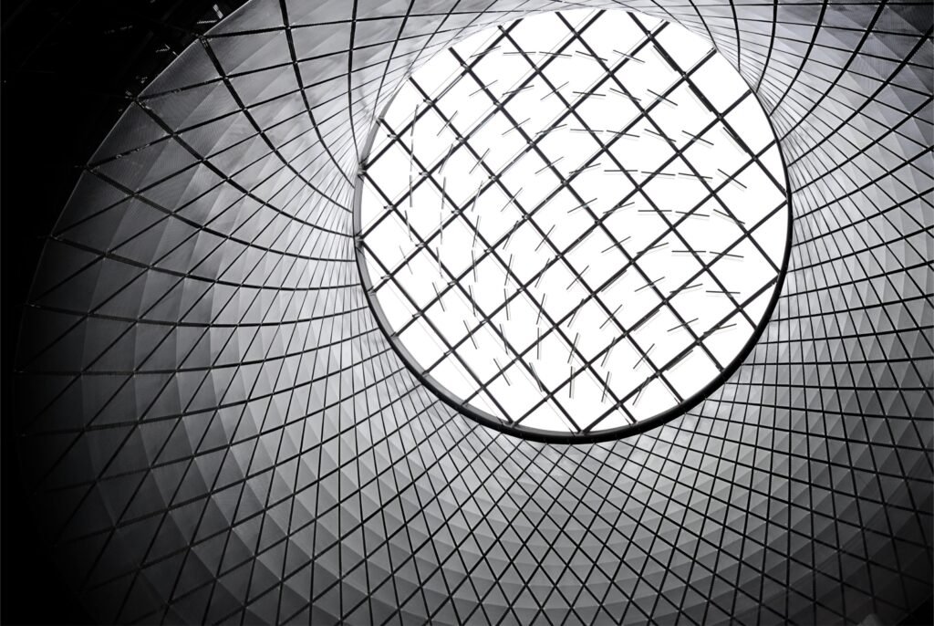 Worm's eye view of a futuristic geometric skylight showcasing modern architecture.